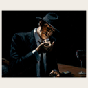 Man Lighting Cigarette at Bar